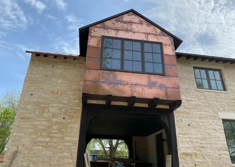 Copper metal panel facade on a stone building for Skylight Installation in Moorpark